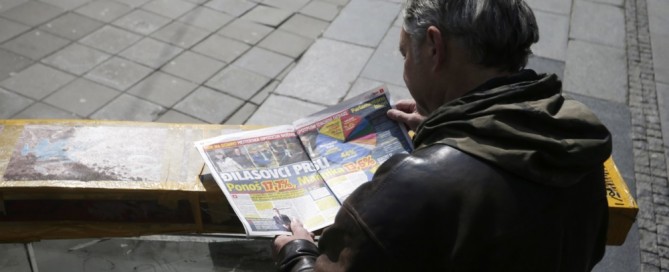 A man reads a newspaper showing election results in Belgrade, Serbia, 04 April 2022. Unofficial results of the general elections held in Serbia on 03 April 2022 show Vucic and his Serbian Progressive party (SNS) as overall winners. EPA-EFE/ANDREJ CUKIC