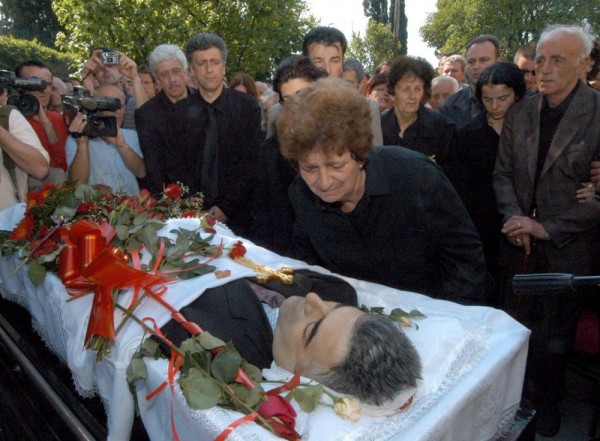 Dara Jovanovic, mother of Dusko Jovanovic, a prominent Montenegrin editor of daily newspaper "Dan" (The Day), mourns over her son's coffin during the funeral service on Sunday 30 May 2004 in Podgorica. Jovanovic was killed early Friday 28 May, as he entered his car in front of the Dan newspaper's head office. A controversial journalist, was considered close to conservative opposition parties in Montenegro and his paper was frequently critical of the ruling coalition headed by Montenegrin Prime Minister Milo Djukanovic. The Police have offered a reward of 1 million Euros (US$1,2 million) for information that would lead to possible arrests. EPA/ZIVOTA CIRIC