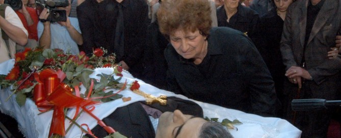 Dara Jovanovic, mother of Dusko Jovanovic, a prominent Montenegrin editor of daily newspaper "Dan" (The Day), mourns over her son's coffin during the funeral service on Sunday 30 May 2004 in Podgorica. Jovanovic was killed early Friday 28 May, as he entered his car in front of the Dan newspaper's head office. A controversial journalist, was considered close to conservative opposition parties in Montenegro and his paper was frequently critical of the ruling coalition headed by Montenegrin Prime Minister Milo Djukanovic. The Police have offered a reward of 1 million Euros (US$1,2 million) for information that would lead to possible arrests. EPA/ZIVOTA CIRIC