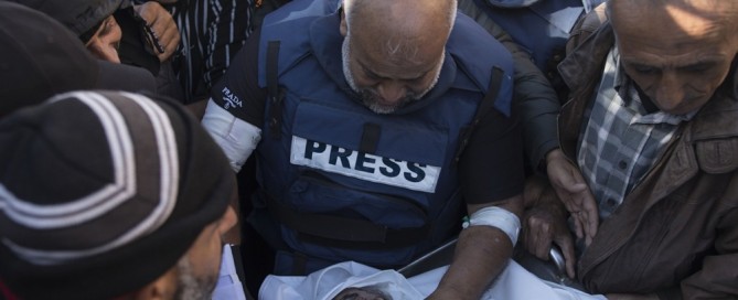 Relatives of Palestinian journalist Samer Abu Daqqa, cameraman for Al Jazeera, who was killed during Israeli air strikes in the southern Gaza Strip, with press crews next to his wrapped body, outside Nasser Hospital in Khan Yunis, southern Gaza Strip, 16 December 2023. EPA-EFE/HAITHAM IMAD