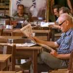 Men reading newspapers in a cafe in Nicosia, Cyprus. Credits: Shutterstock / Tanya Kalian