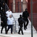 The alleged perpetrators of the assassination of Greek investigative journalist Giorgos Karaivaz, then acquitted, are escorted by a police special force outside the Mixed Jury Court, in Athens, Greece, 26 June 2024. Karaivaz was one of Greece's most prominent investigative journalists specializing in organized crime and police reporting when he was gunned down in broad daylight outside his Athens home on 09 April 2021. Credits: epa11438865 EPA-EFE/YANNIS KOLESIDIS